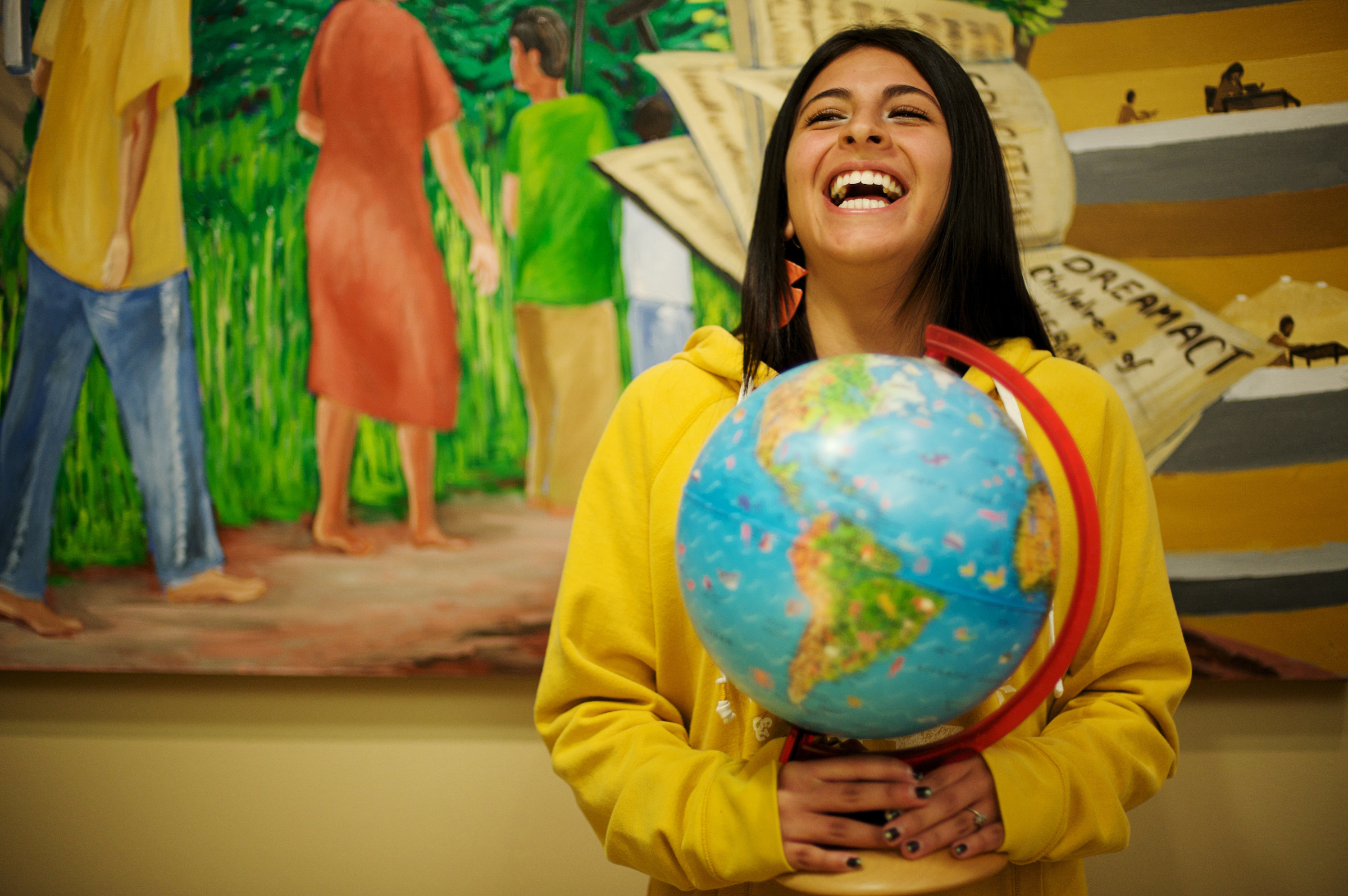 student holding globe