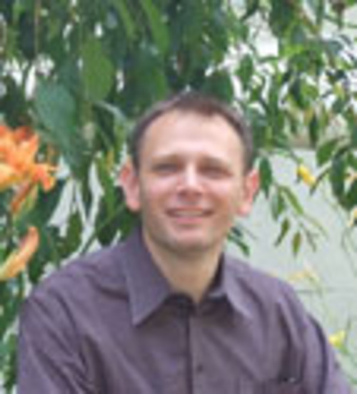 Mark Woods, a thin white man with short brown hair. 