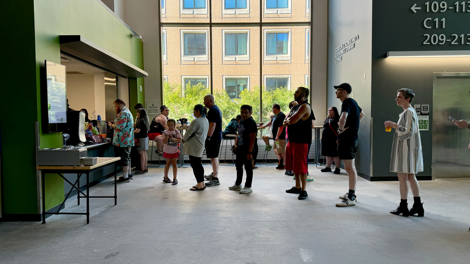 Attendees at Viking Pavilion line up for the concession stand on the northeast concourse near the elevator.