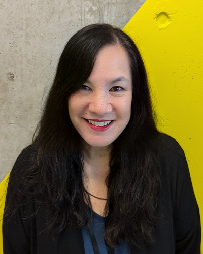 Laura Sequeira, Admissions Advisor, a half-Chinese half-Caucasian woman with long, wavy black hair and a warm, friendly smile.