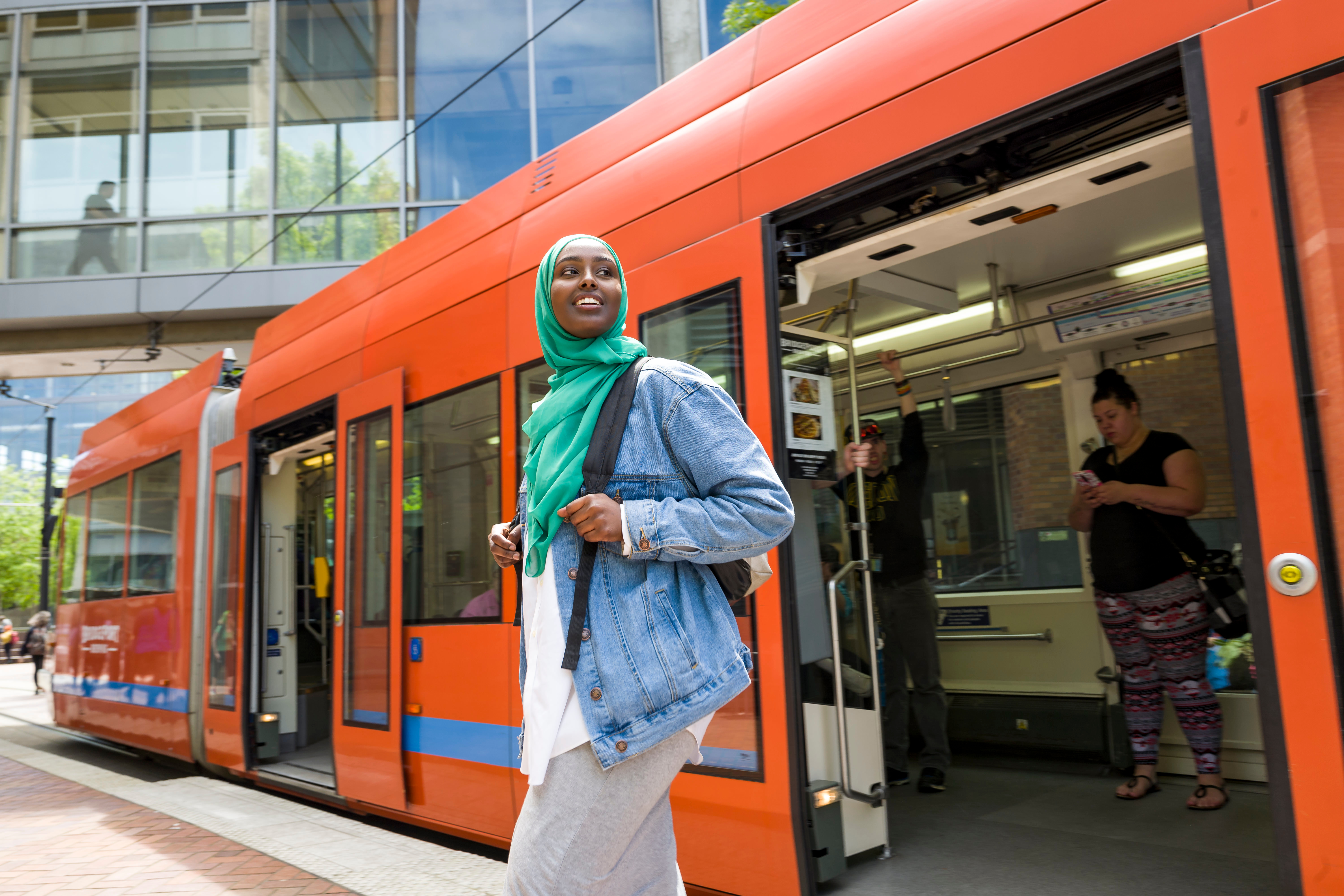 Woman Leaving MAX Rail Car