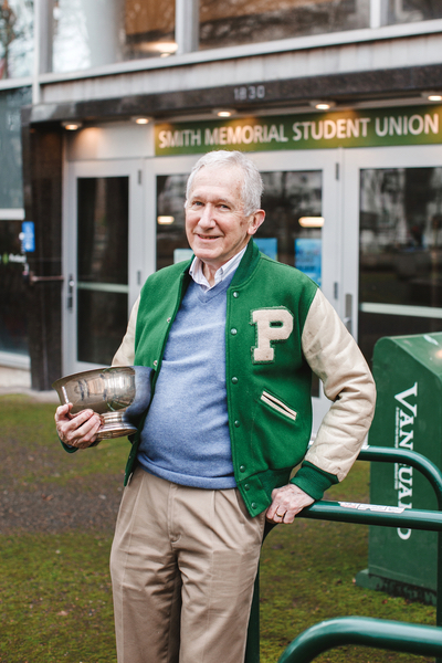 Jim Westwood holding the College Bowl trophy