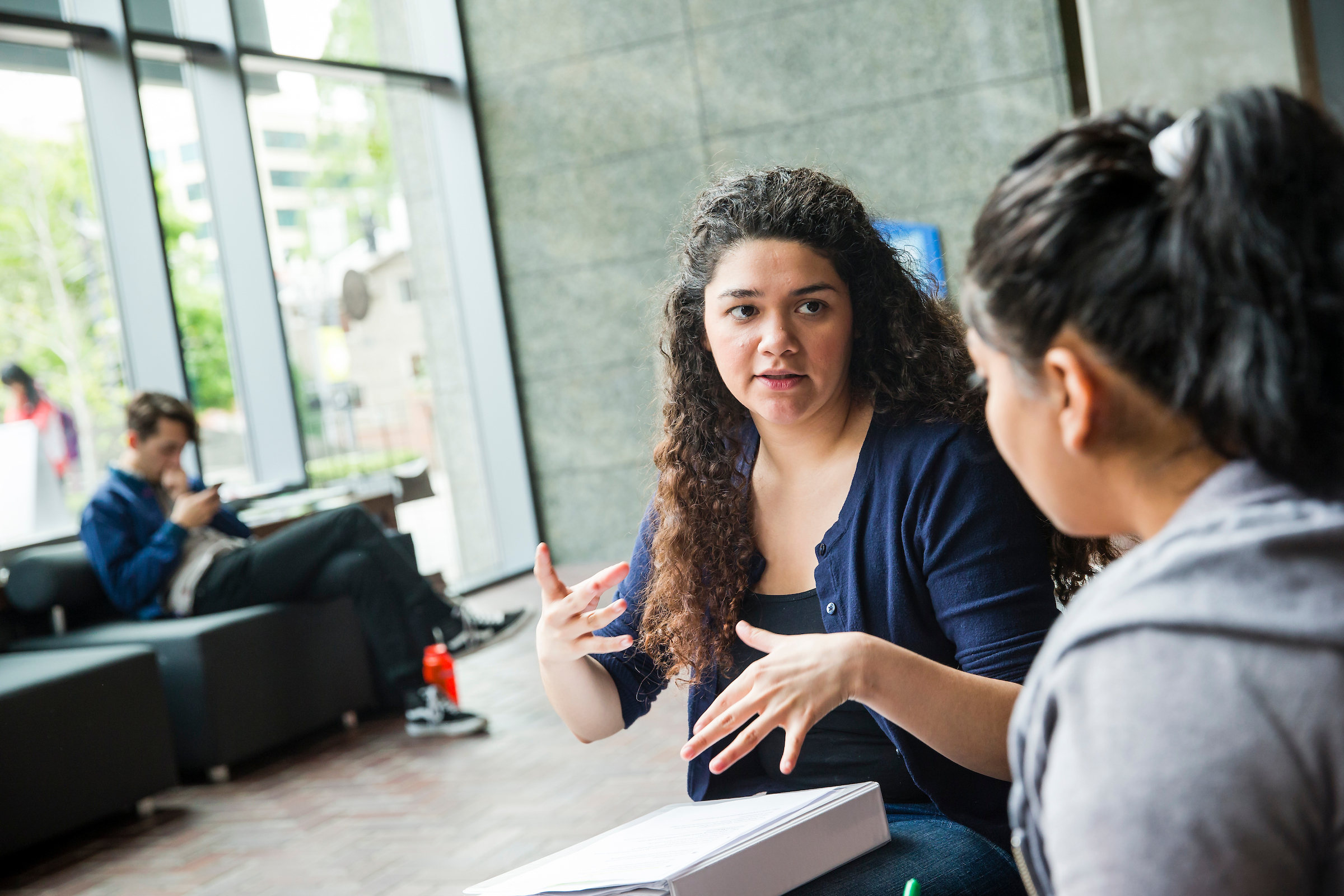 Two students conversing