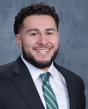 Person with beard and suit