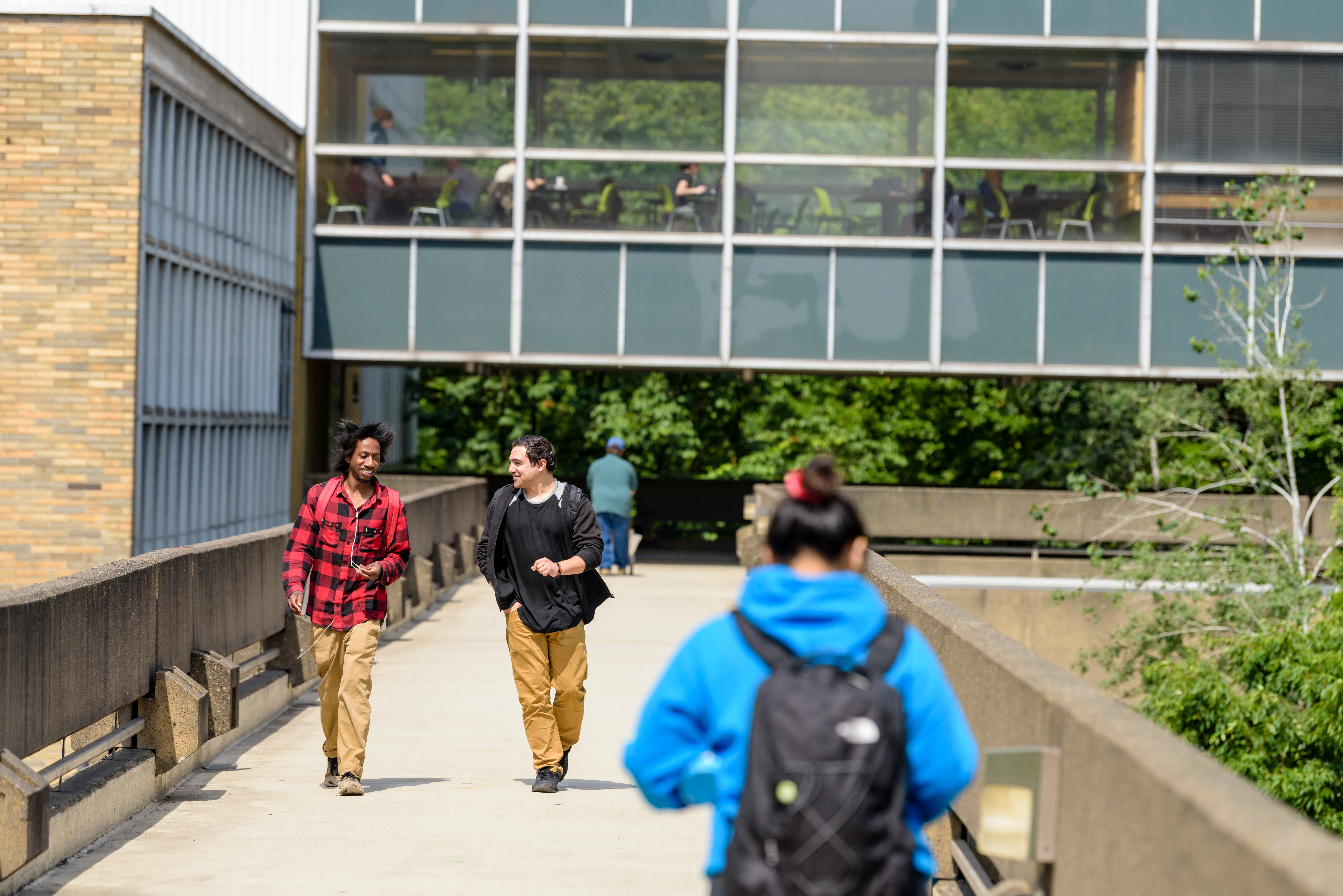 several students crossing one of PSU's sky bridges between buildings