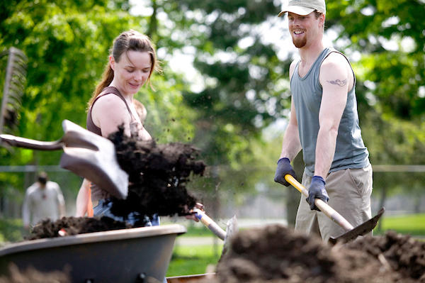 Two students gardening. 