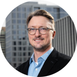 headshot of greg schrock