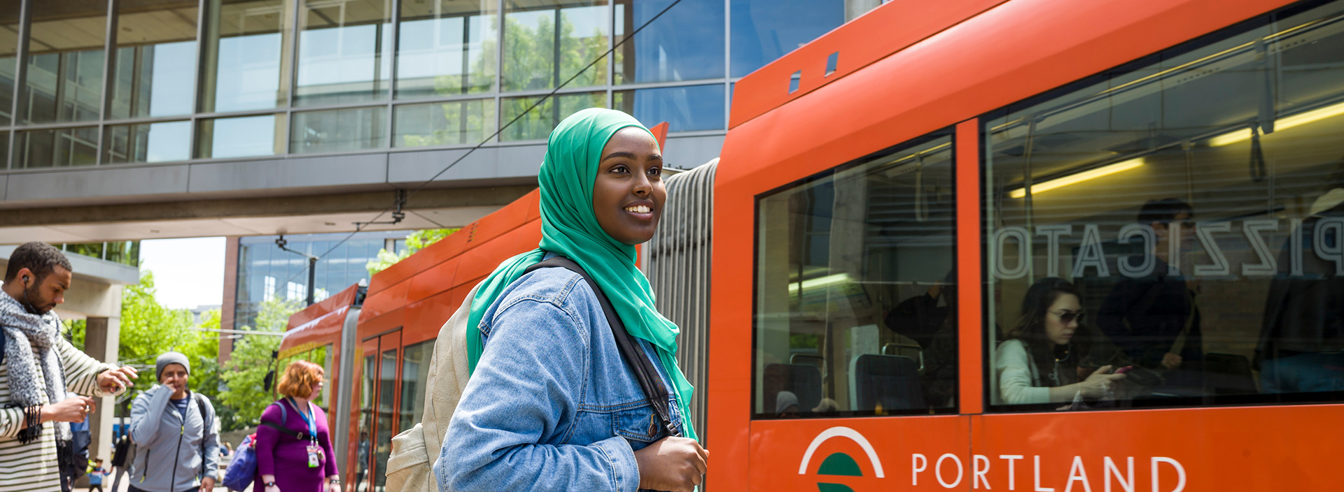 Portland State University student boarding the Portland Streetcar